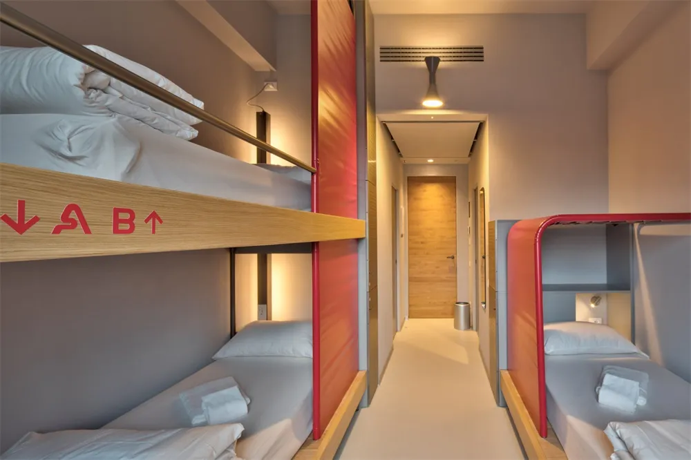 A modern minimalist bedroom with wooden furniture and clean, simple design.