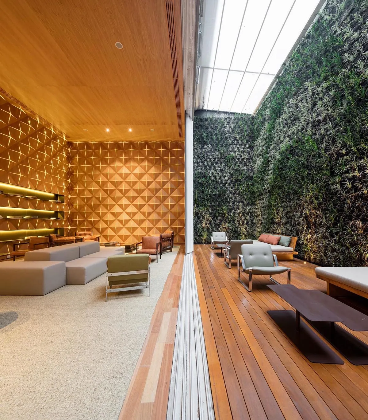 Modern indoor relaxation area with wooden seating and green wall