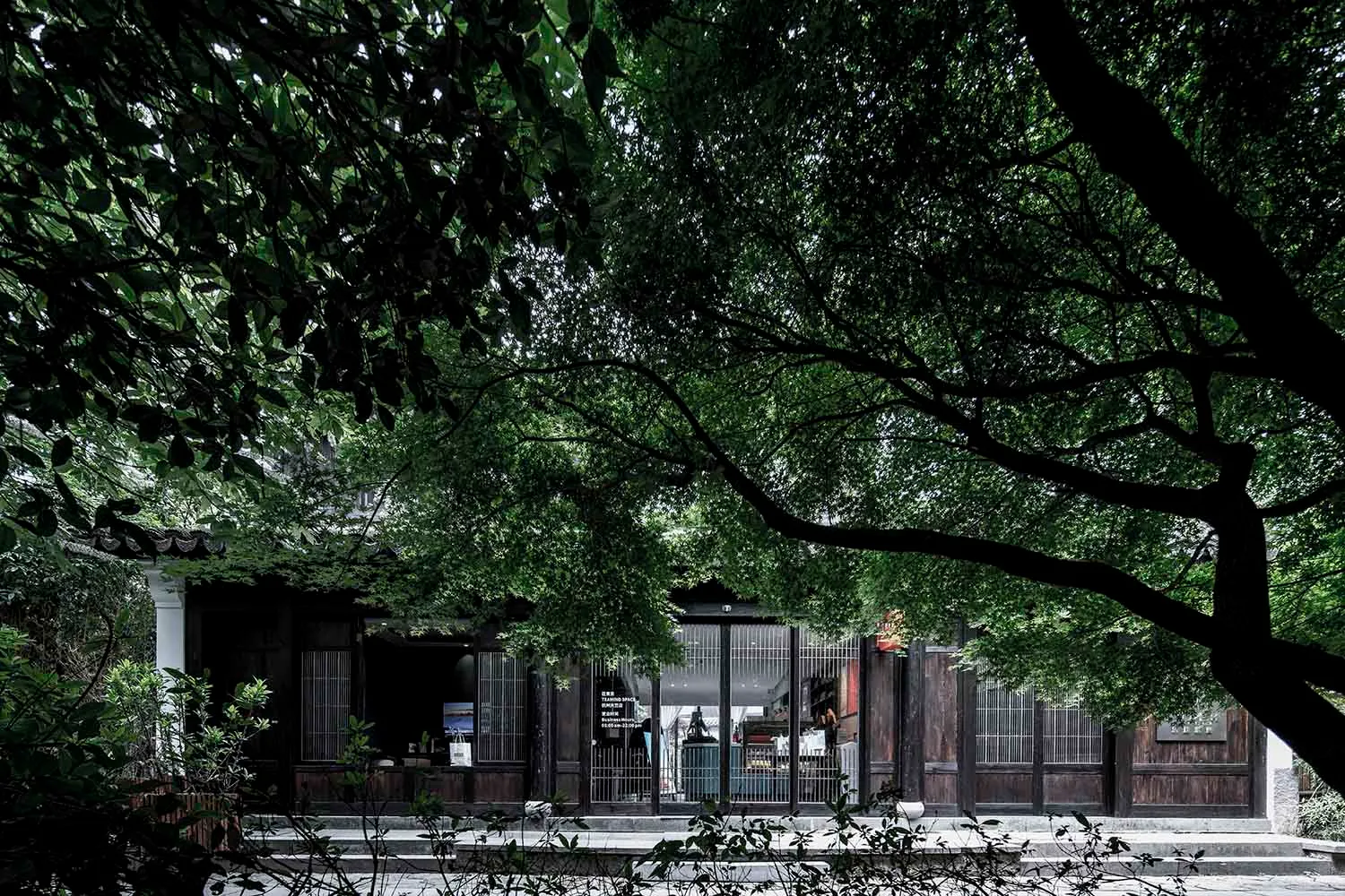 A traditional retail storefront with wood, metal, and glass materials.