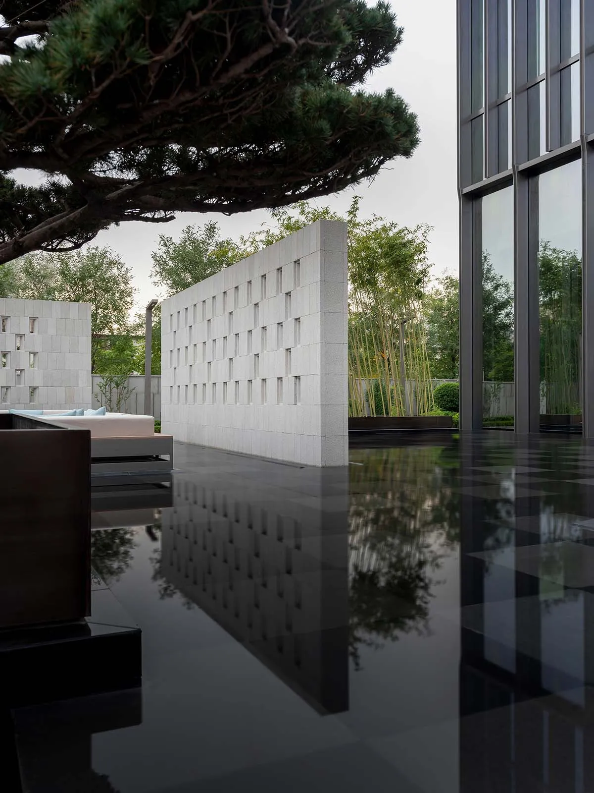 Modern architectural design featuring concrete and terrazzo materials.