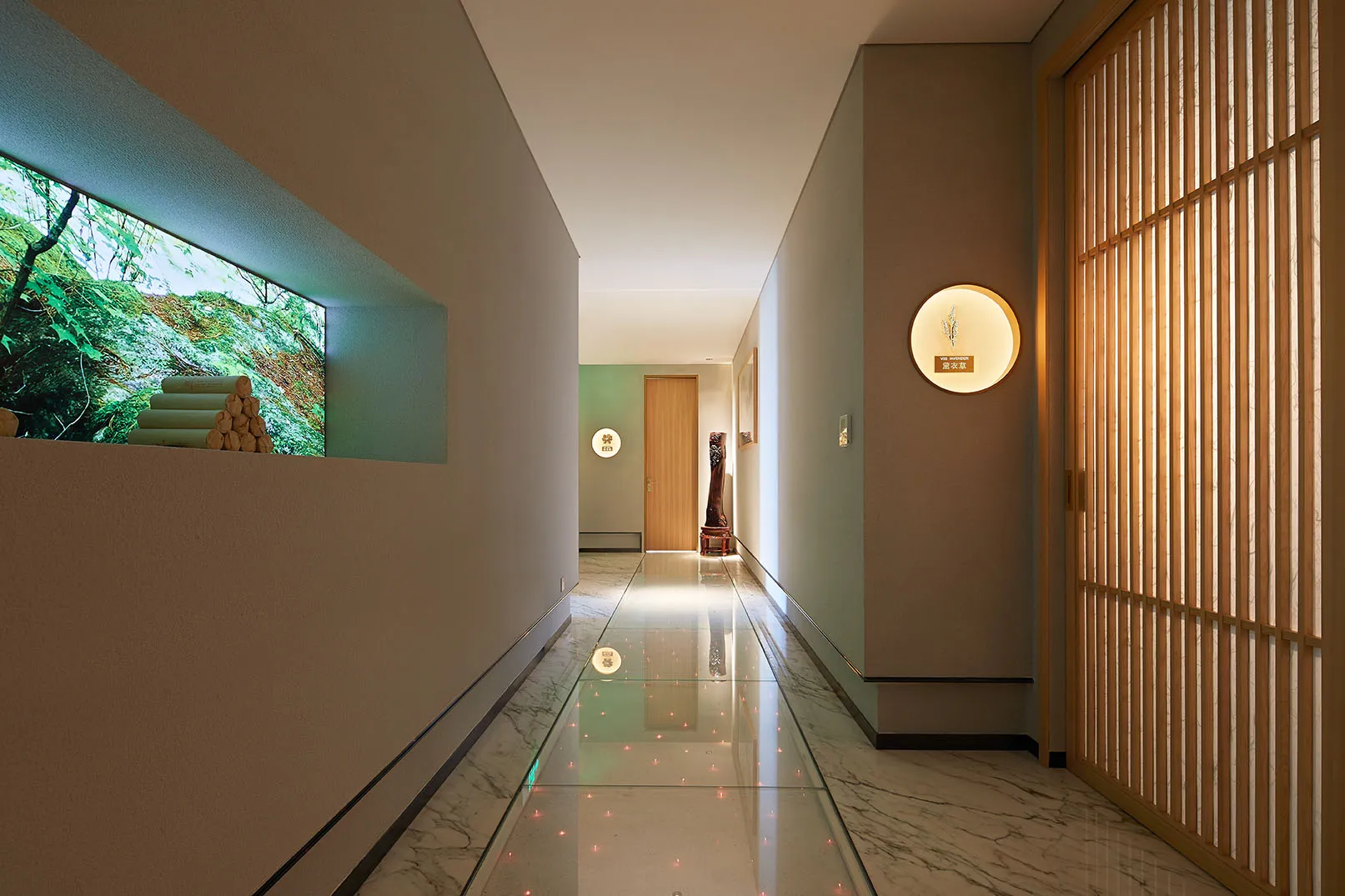 Modern interior design featuring a corridor with marble flooring and wooden accents.