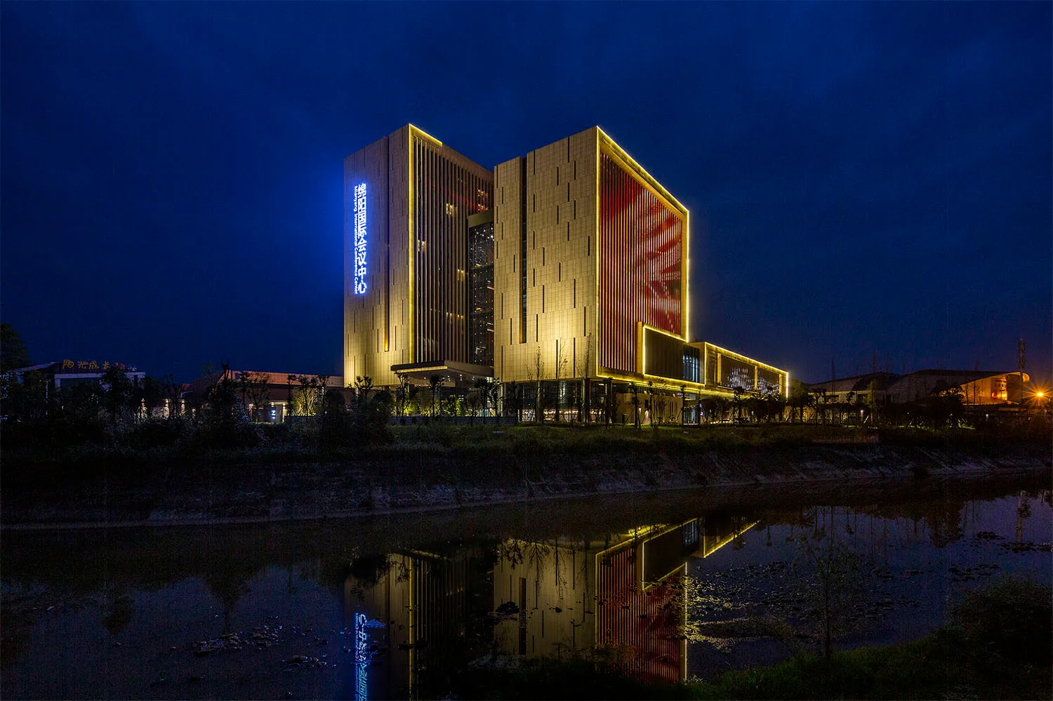 A modern conference center with glass and steel exterior.