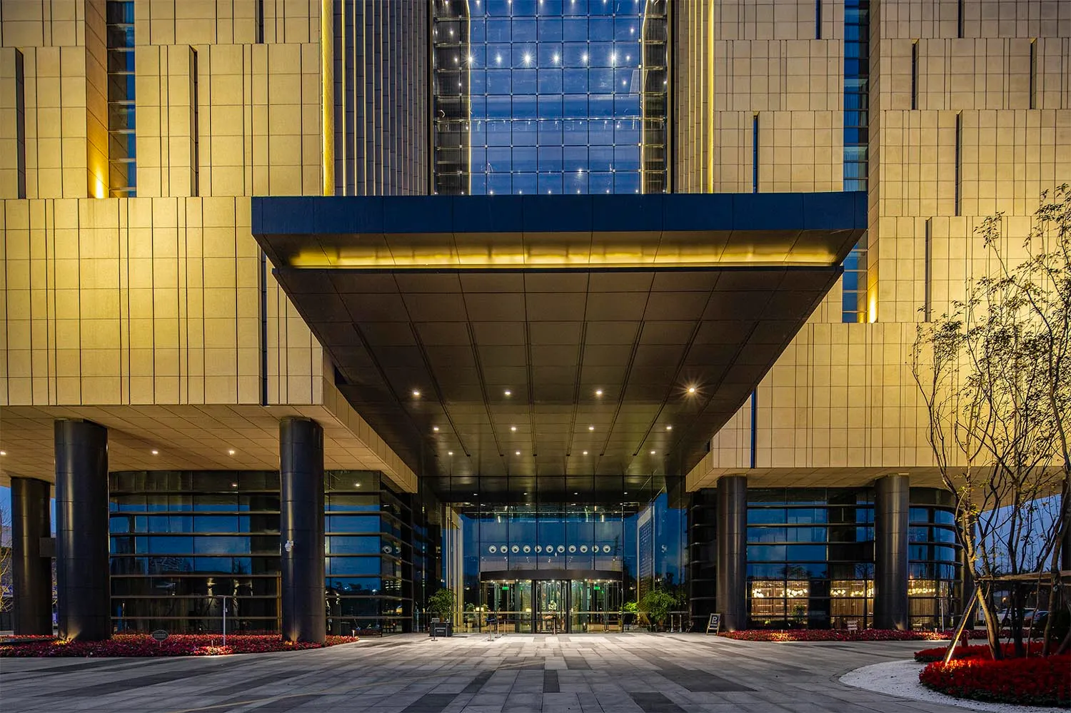 Modern lobby featuring glass walls and interior design elements.