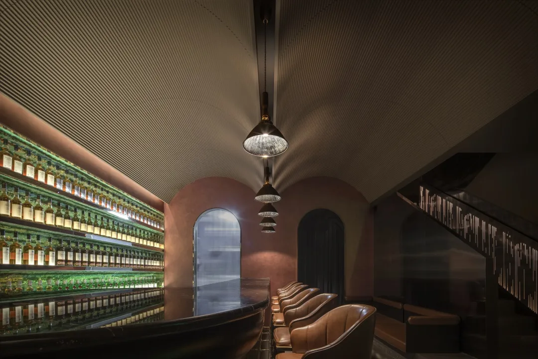 Industrial-style bar constructed with wood, metal, and glass materials