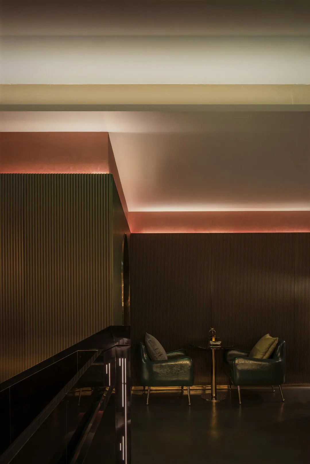 A modern restaurant bar with metallic-texture walls and ceiling.