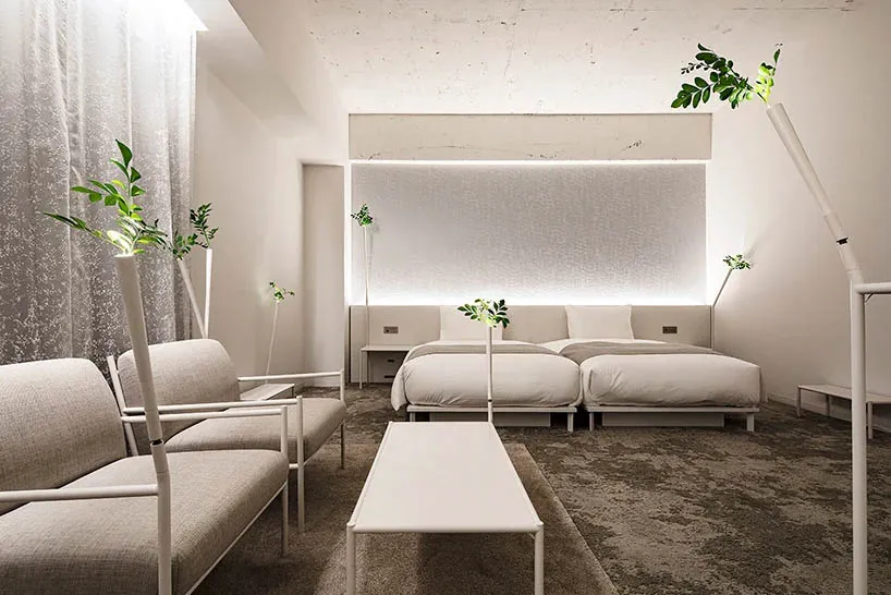 A modern minimalist living room featuring sleek furniture, contemporary decor, and sophisticated technology.