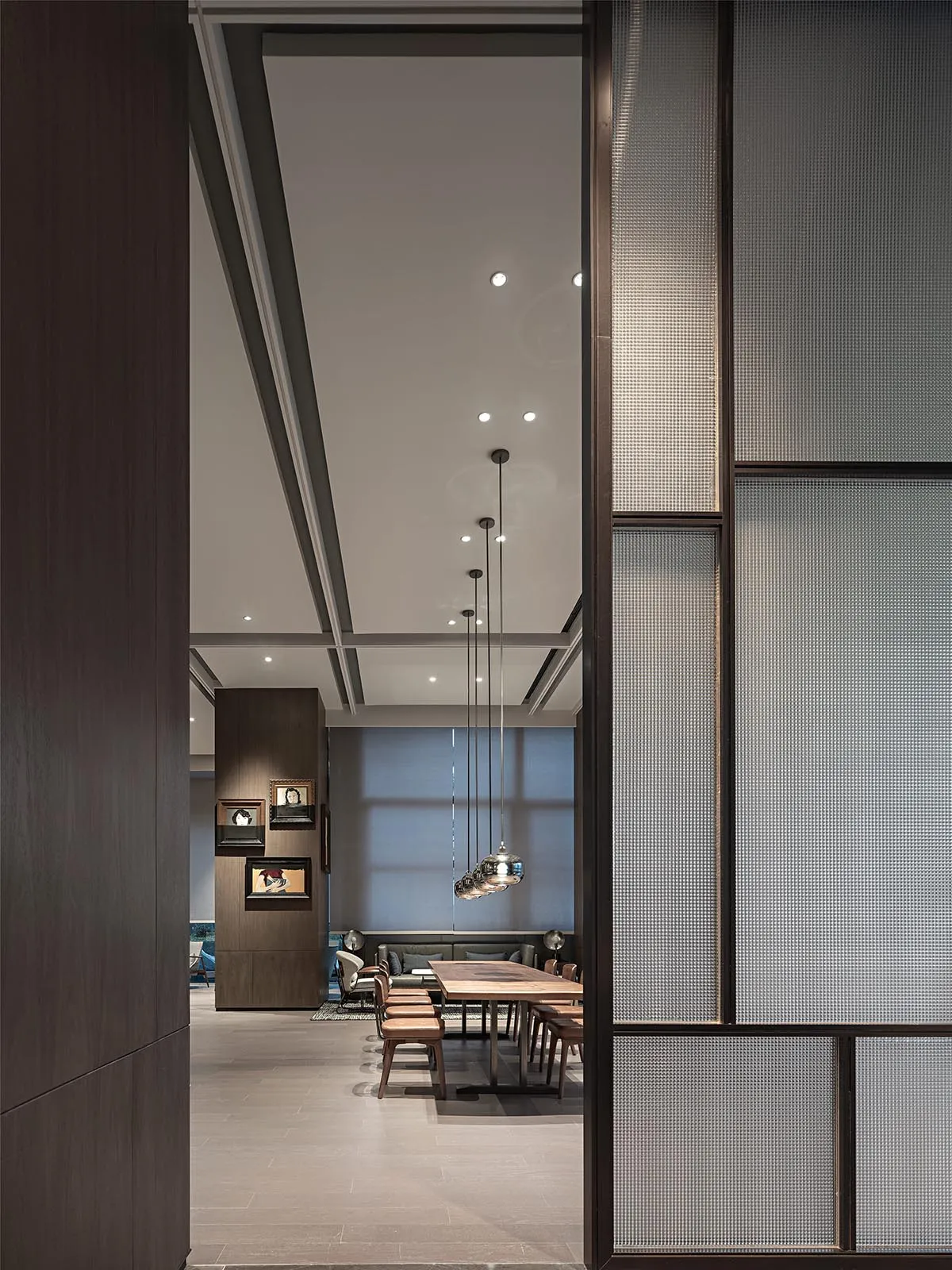 Modern restaurant and bar interior designed with concrete and glass furniture.