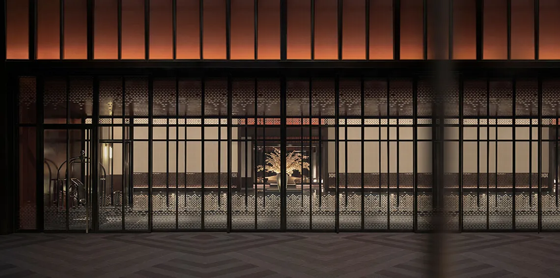 A minimalist storefront with a metallic frame and patina finish.