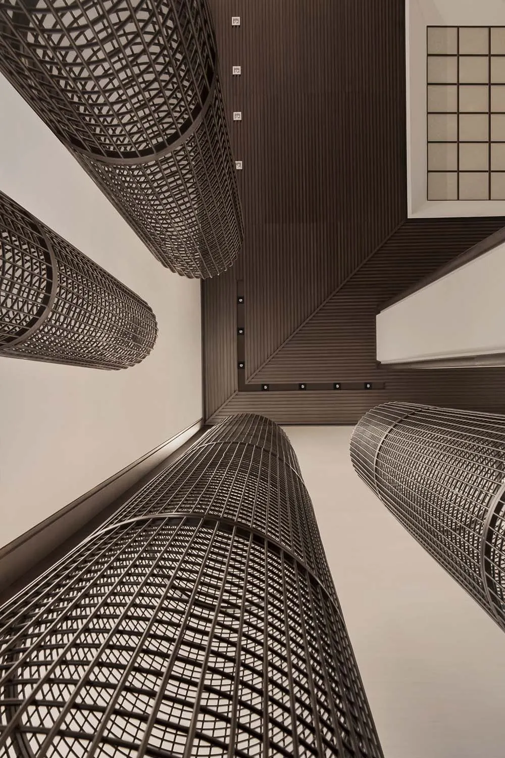 A modern interior design featuring metallic cylindrical structures.