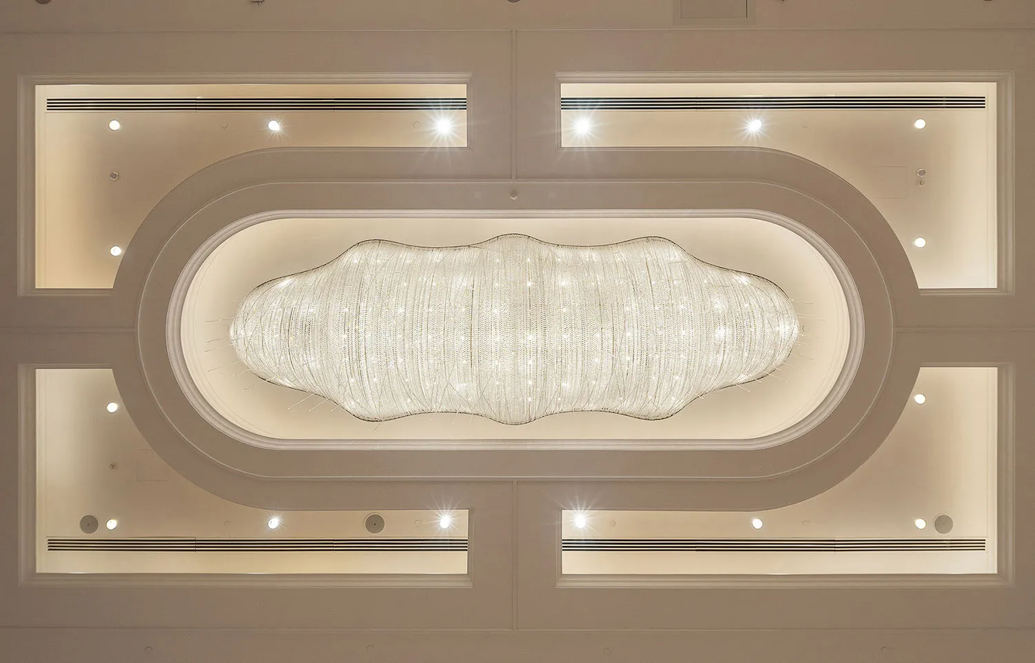 A modern architectural lighting installation featuring glass elements.