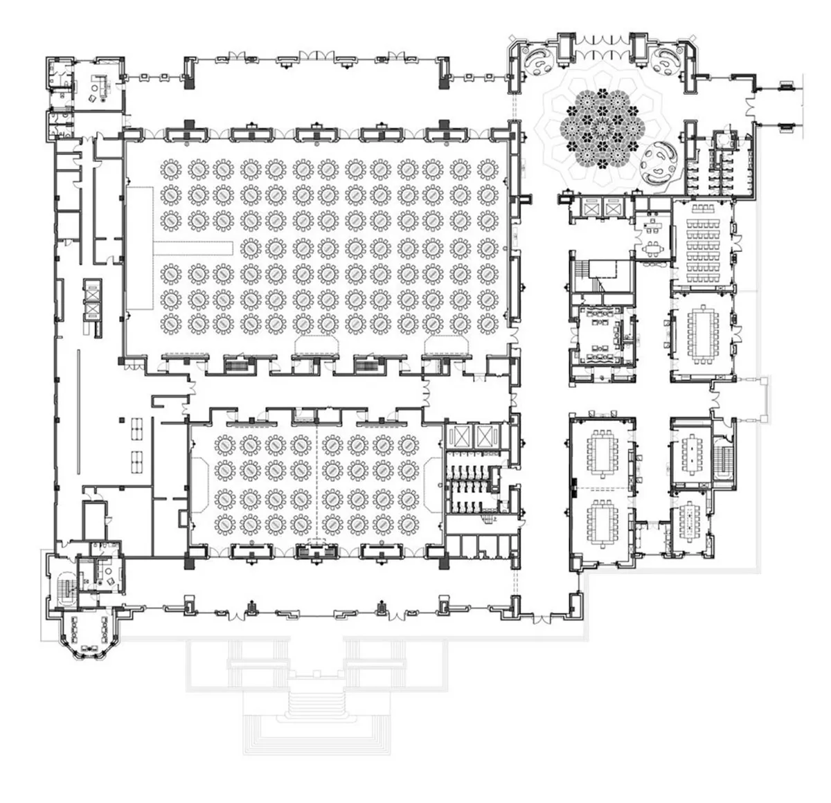 Detailed architectural floor plan of a conference hall with tables and seating arrangements.