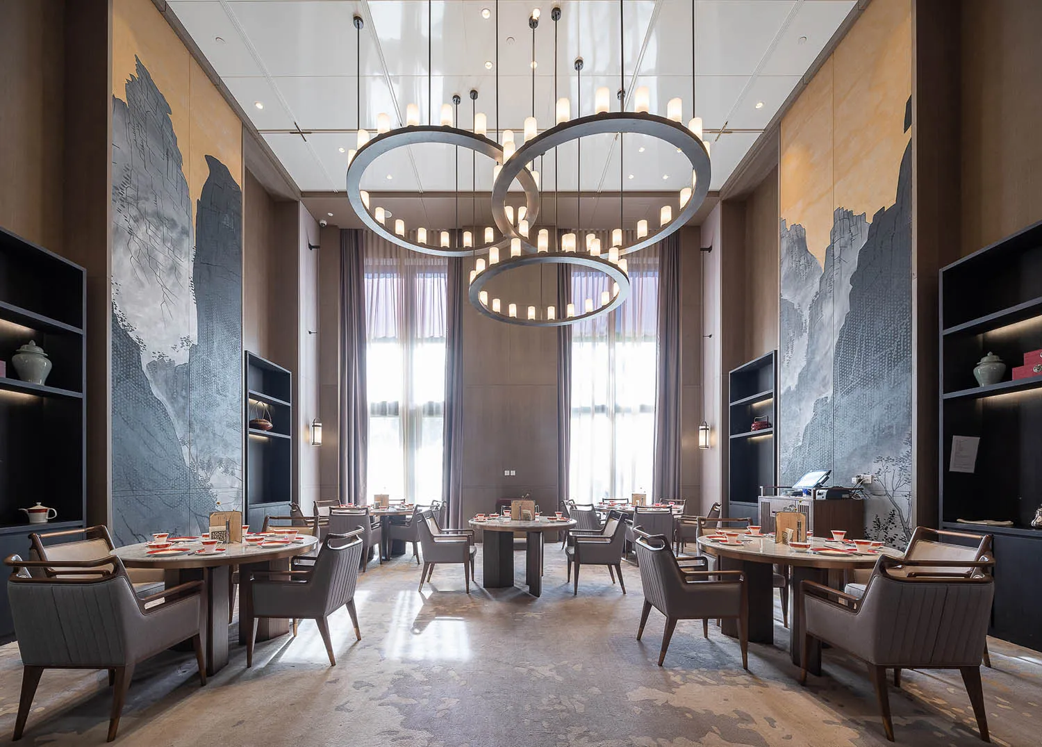 Modern, luxurious dining room with contemporary wood, metal, and textured floor.