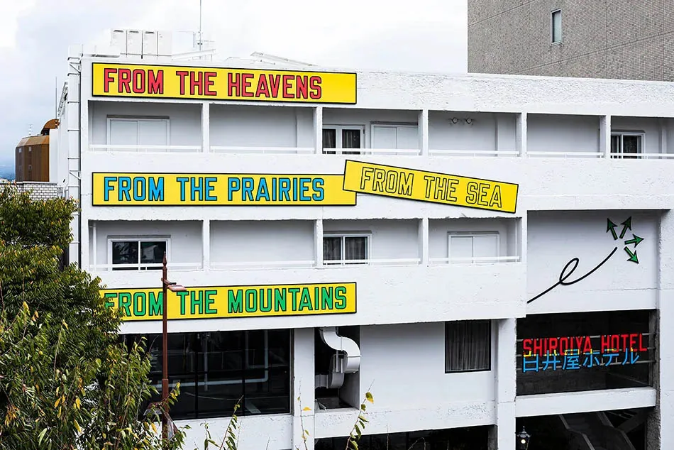 Modern hotel exterior with colorful signage