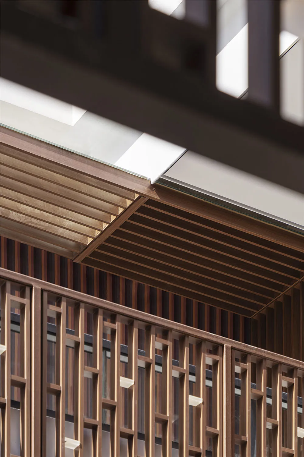 Modern interior design featuring wood paneling and geometric patterns.