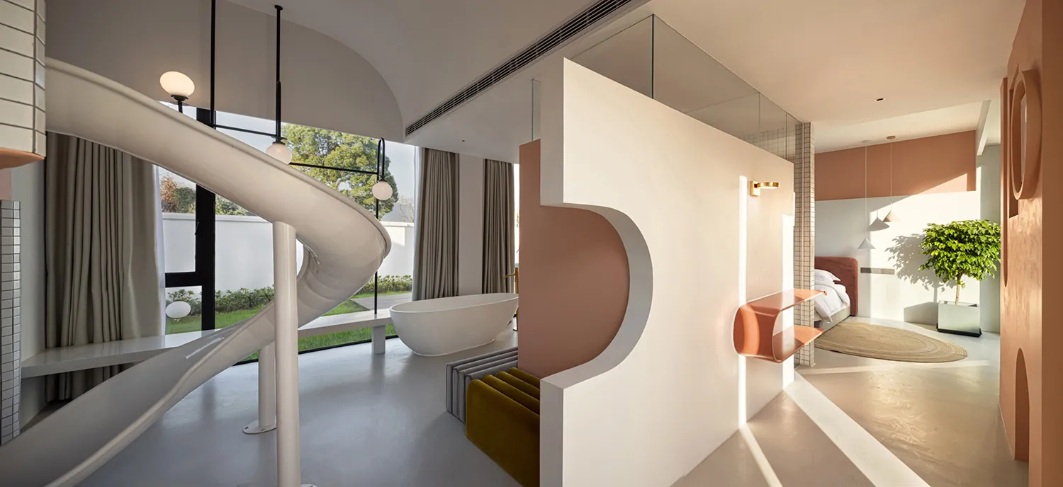 Modern minimalist residential interior with concrete walls, wood accents, and floor-to-ceiling windows.