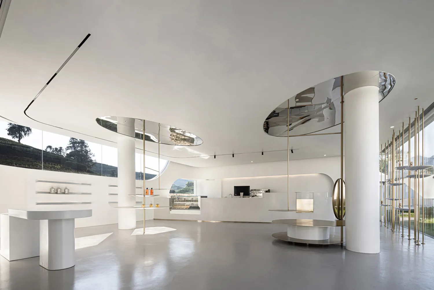 Modern, white-themed coffee shop with metal accents