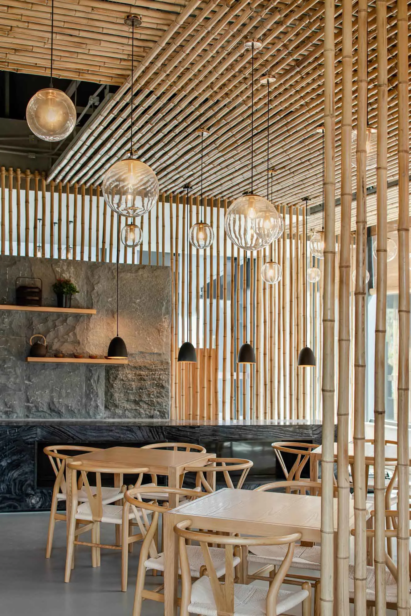 Modern restaurant interior with bamboo ceiling and lighting fixtures