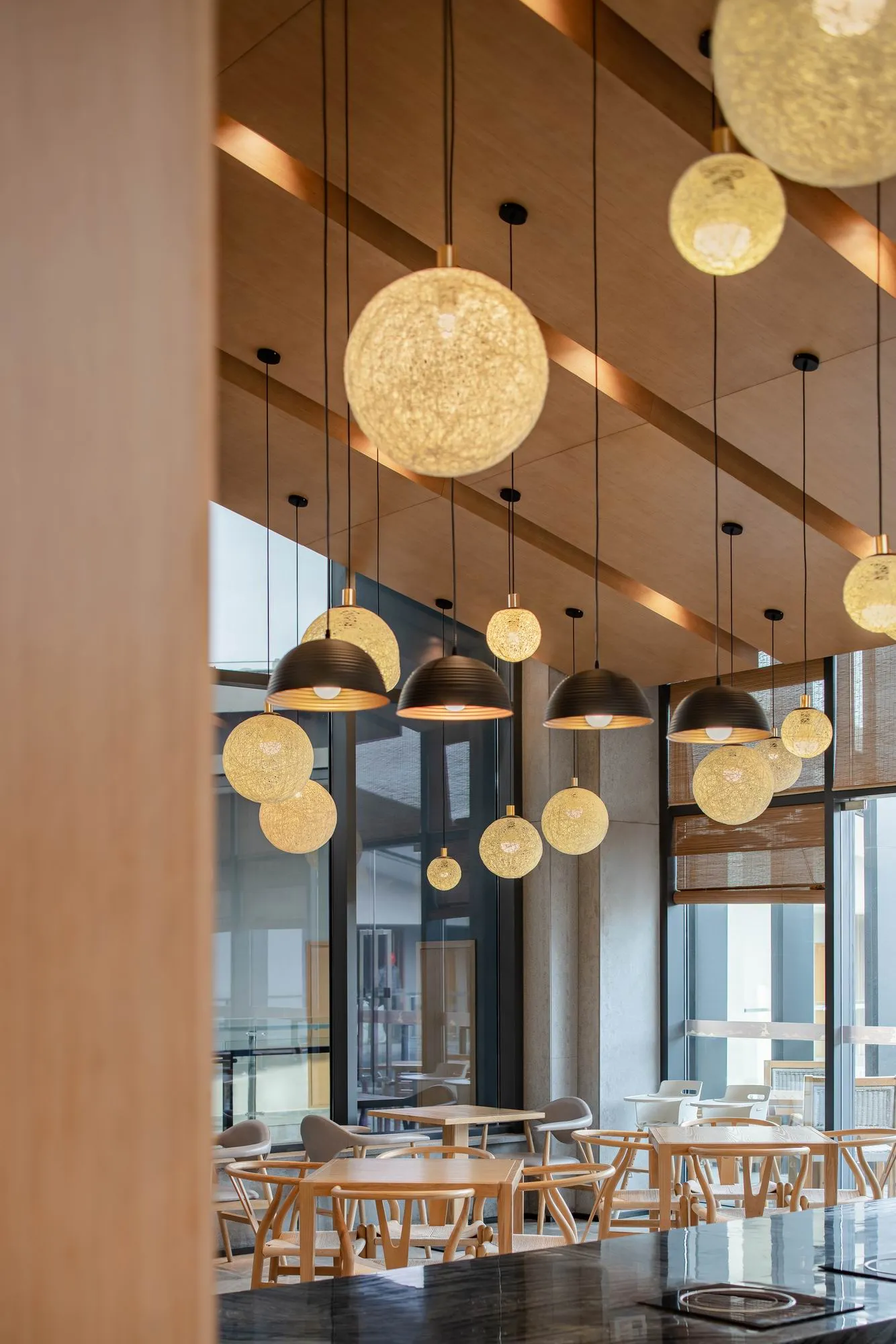 Modern café interior design featuring warm lighting and wooden elements