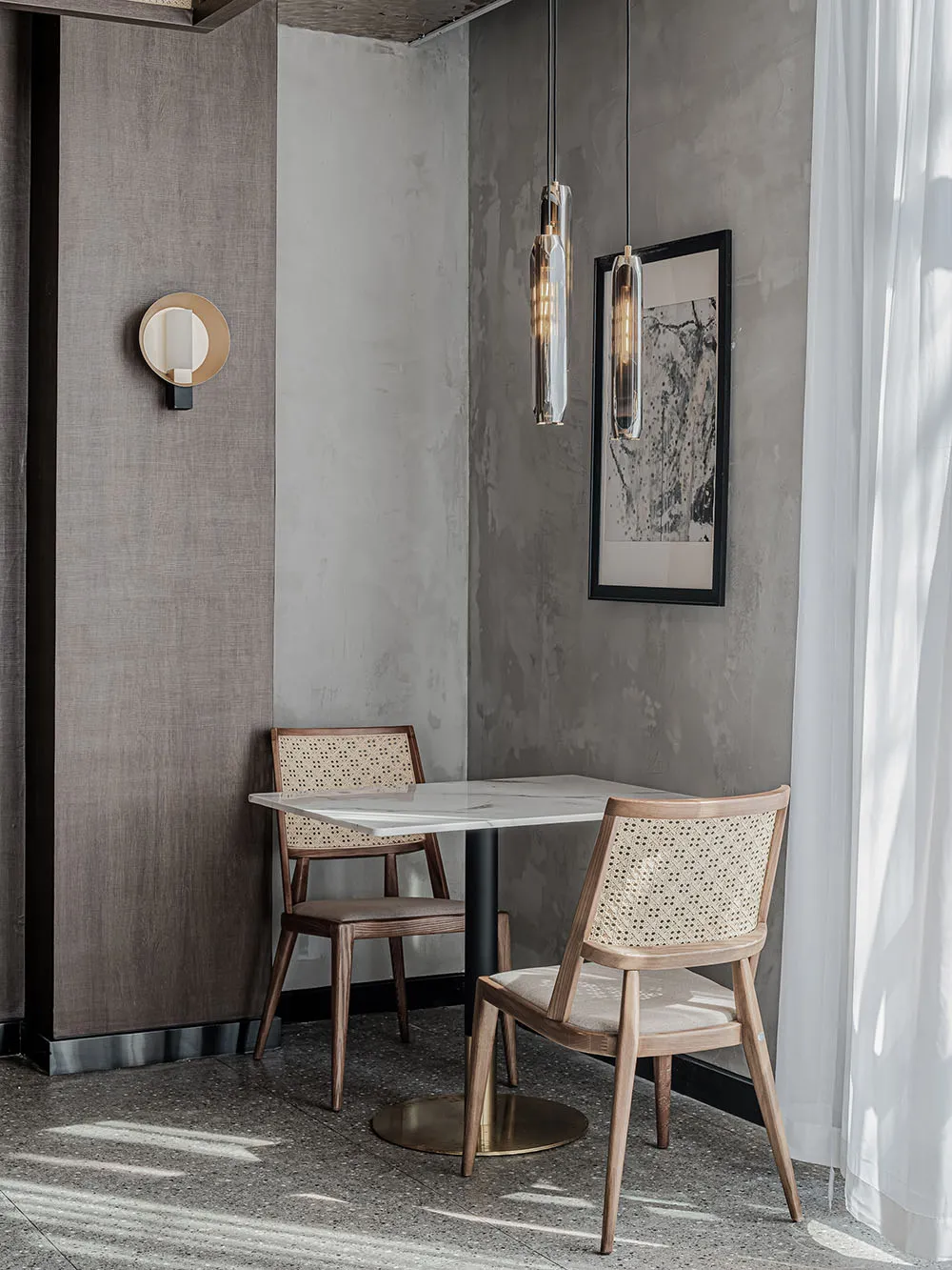 Modern commercial design featuring a restaurant table setting with a contemporary table and chairs, designed with minimalist