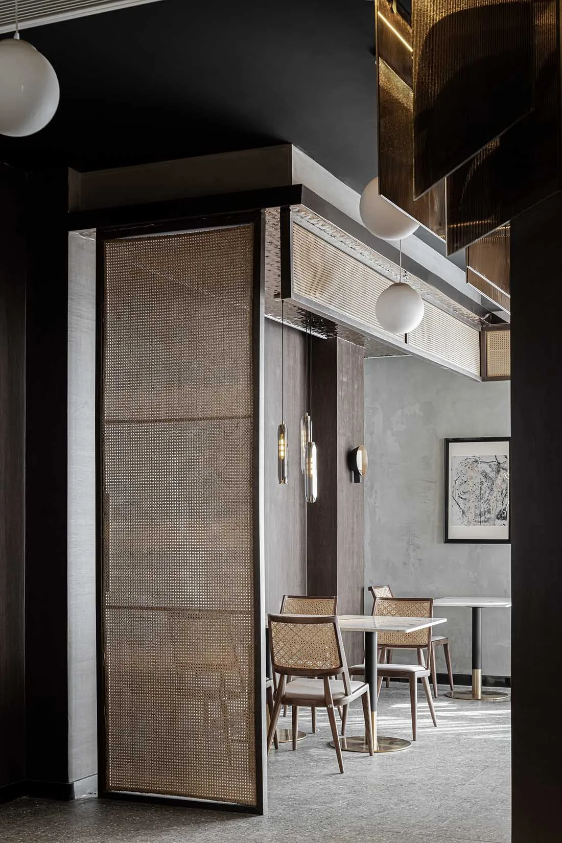 Modern restaurant interior featuring brass accents and wooden furniture.