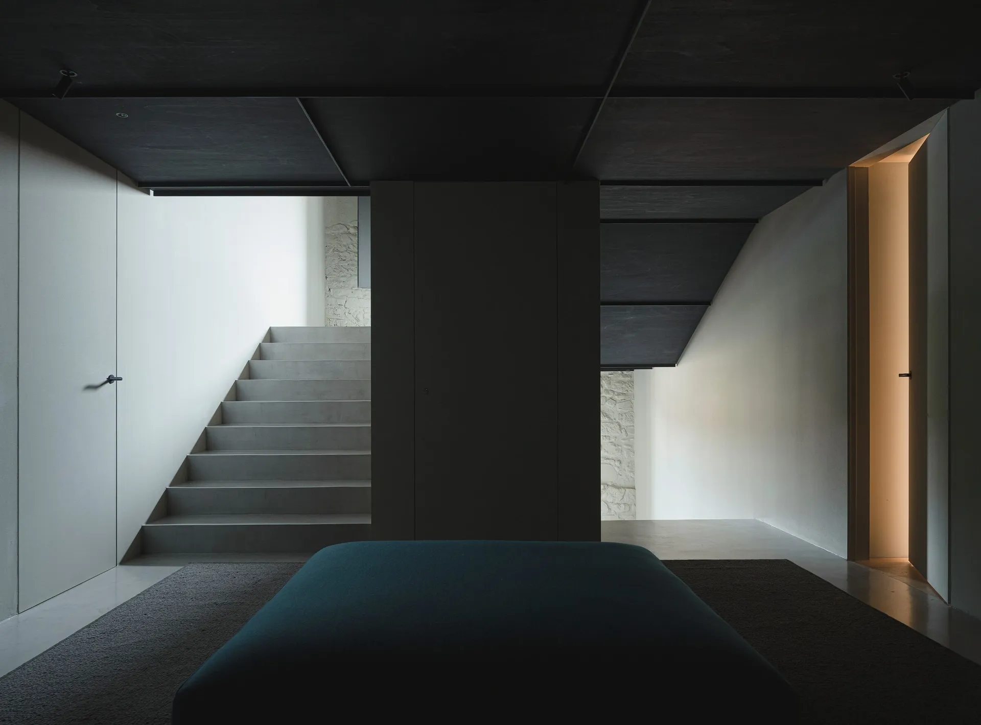 Staircase with concrete steps in a minimalist, modern interior