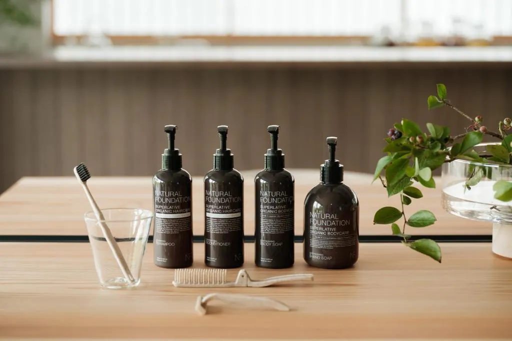 A minimalist bathroom counter with organic haircare products.
