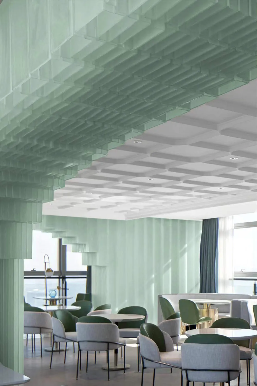 A modern coffee shop with a ceiling composed of green glass squares, creating a futuristic and inviting atmosphere.