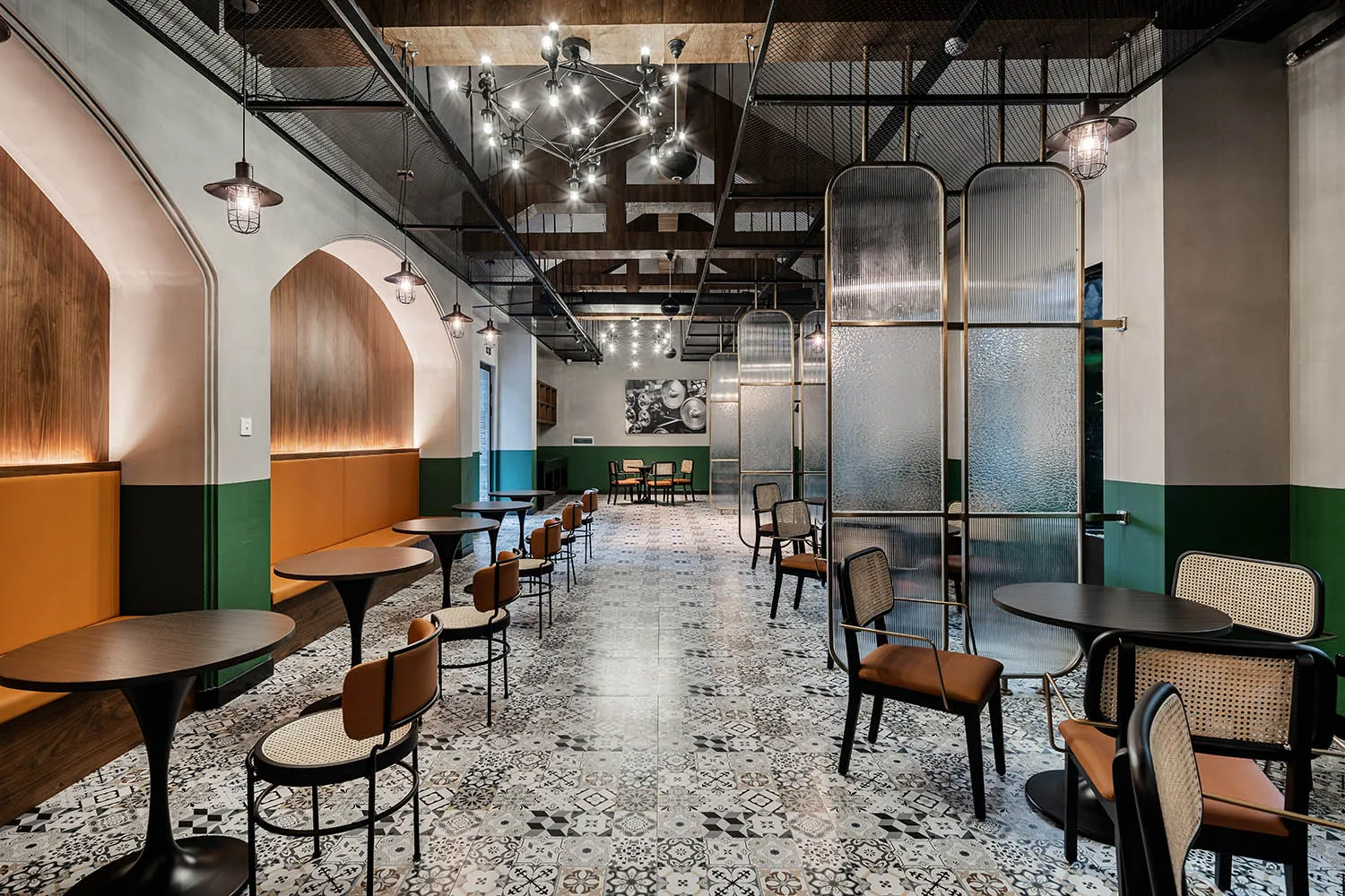 An interior design image of a modern industrial restaurant featuring concrete and glass materials.
