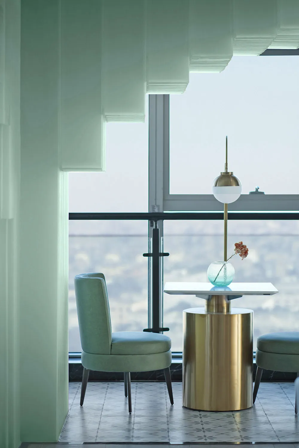 Modern living room featuring metal and glass furniture and decor.