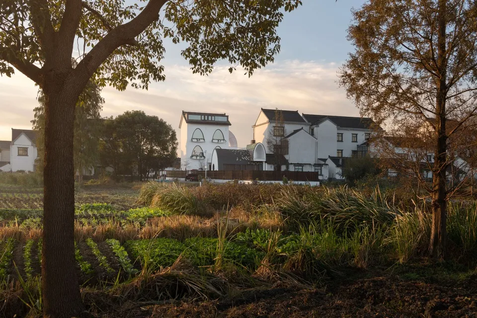 Rural residential cottage with brick exterior and trees