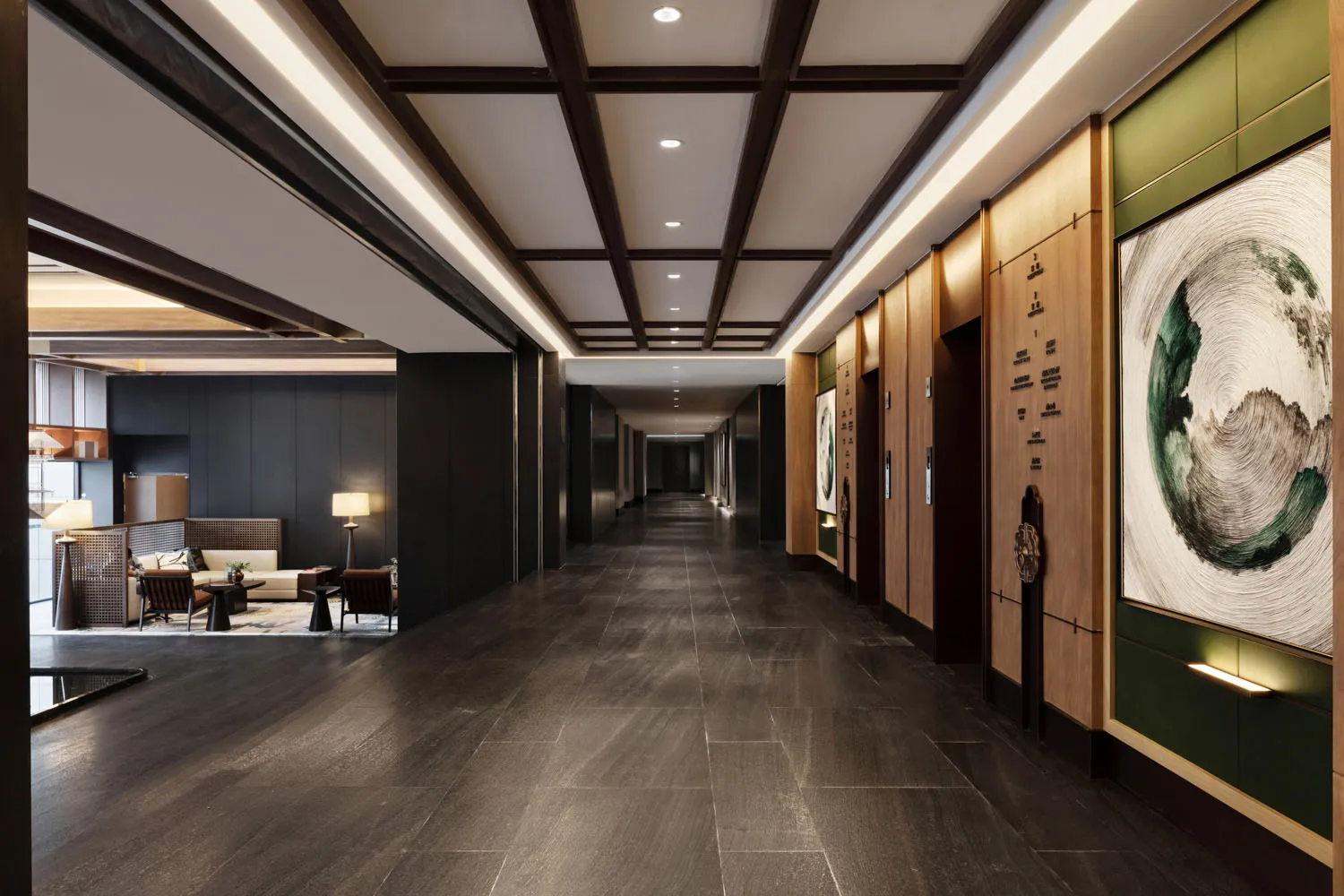A modern hotel lobby featuring concrete and wood materials.
