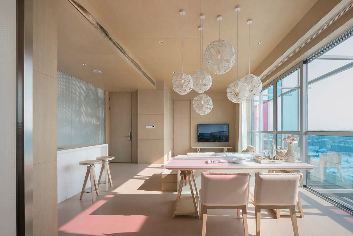 Modern living room featuring a wood and glass interior design.