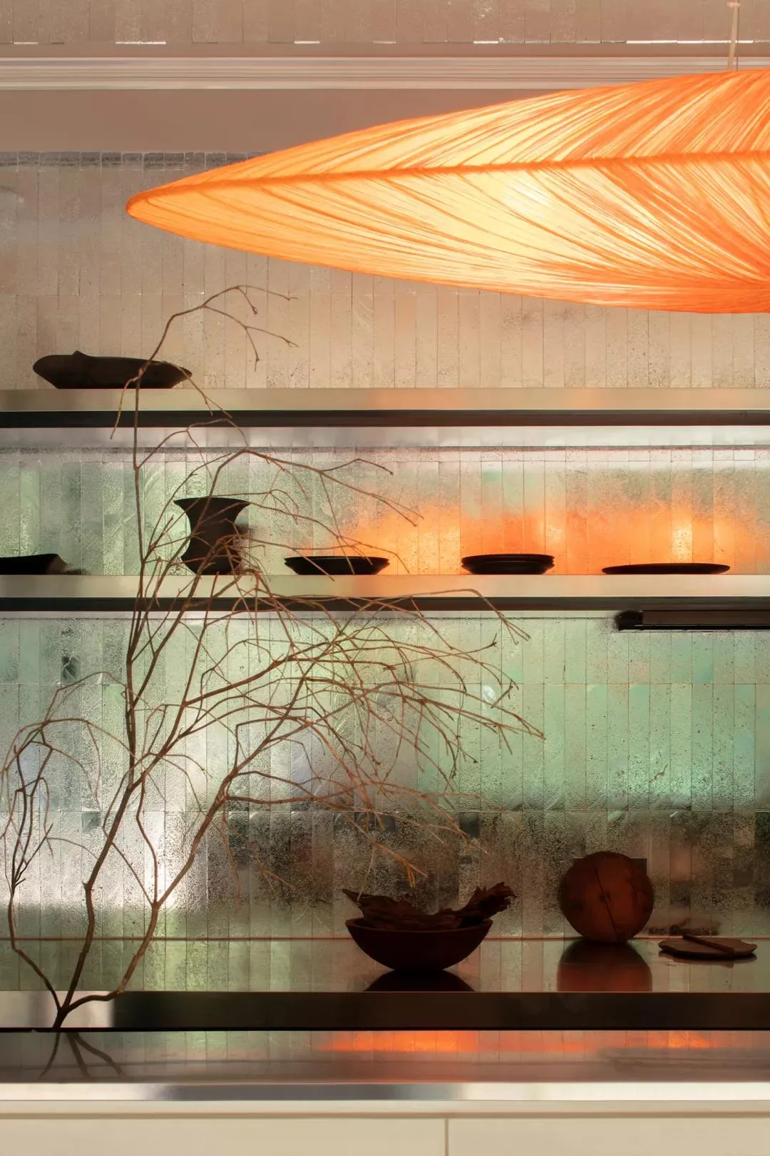 A minimalist interior design featuring glass shelves with textured glass.