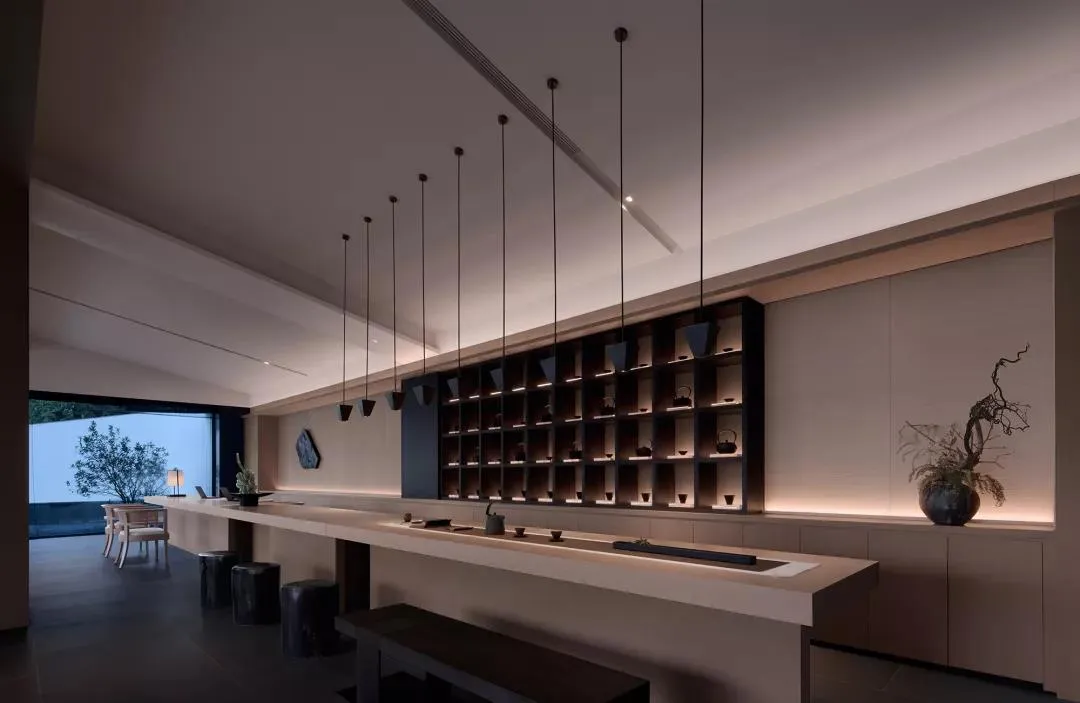A modern coffee shop bar made of concrete and wood materials