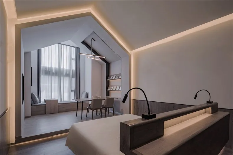 A modern contemporary bedroom with mixed materials including wood, metal, and fabric.