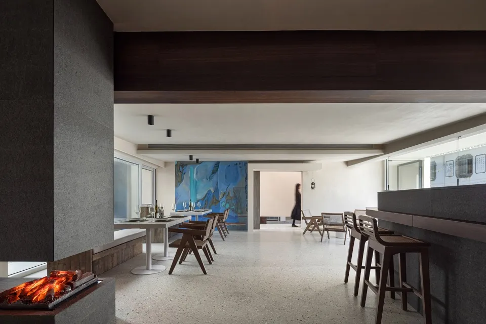 A modern residential living room with concrete flooring.