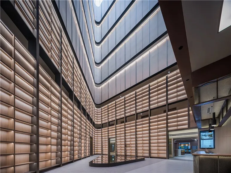 Modern lobby featuring wood-paneled walls and minimalist design.
