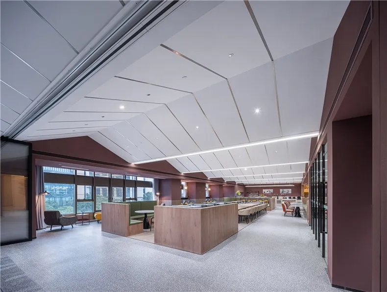 Modern office space with concrete flooring, metal accents, and modern décor.
