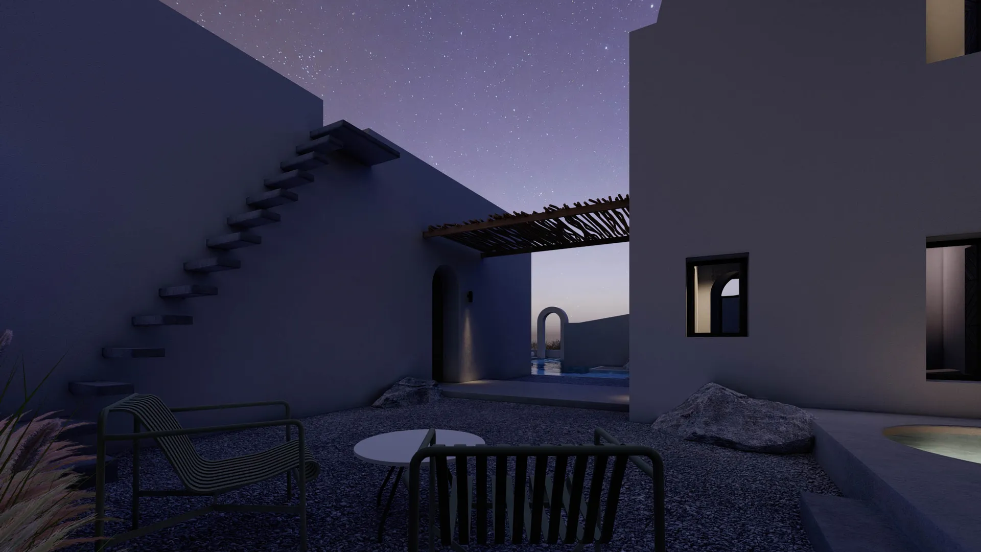 A modern residential exterior featuring concrete and rocks under a starry night sky.