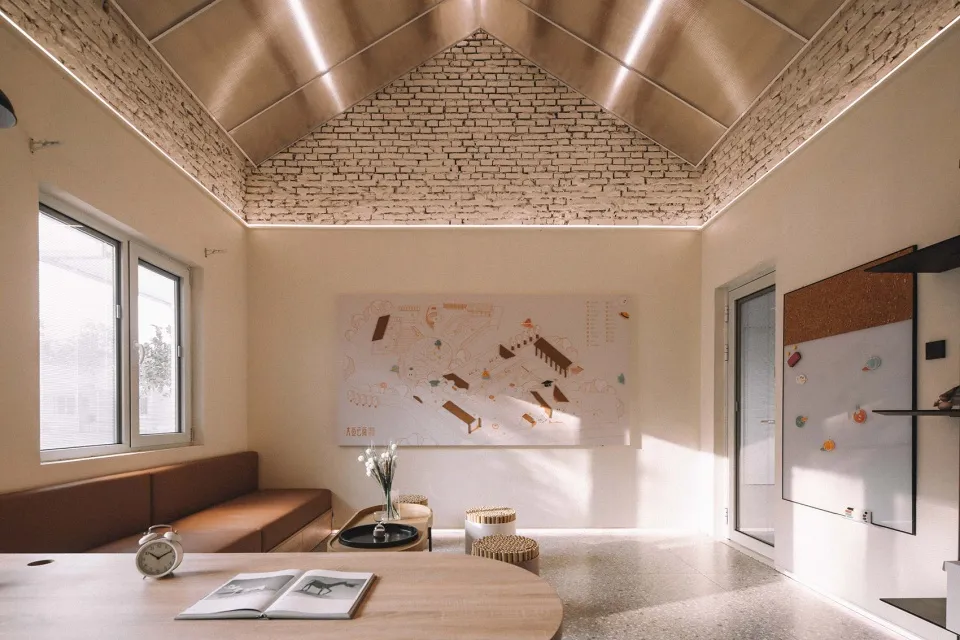 Industrial-style interior design featuring brick, wood, and concrete materials.