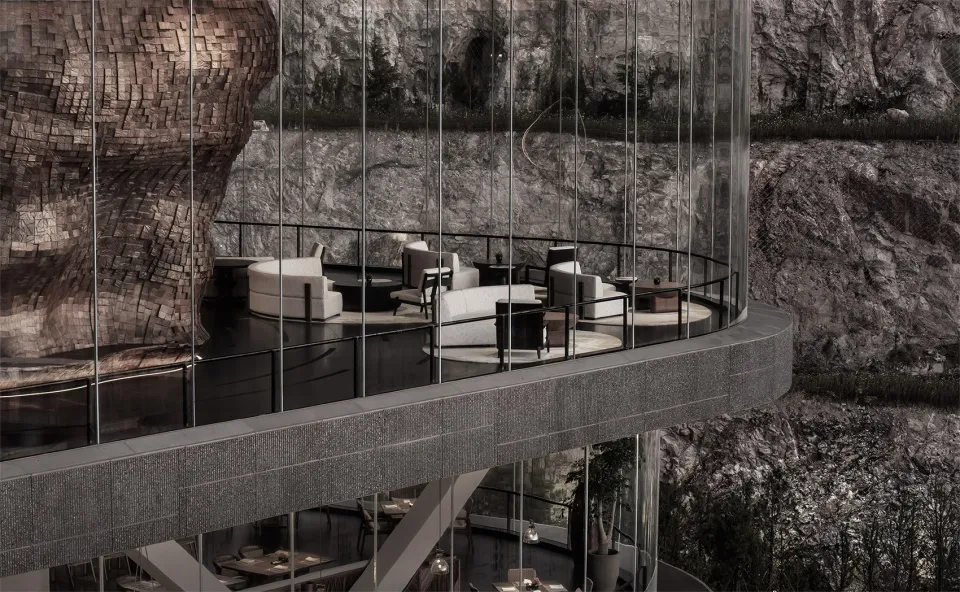 A modern indoor space featuring glass walls overlooking a rocky landscape.