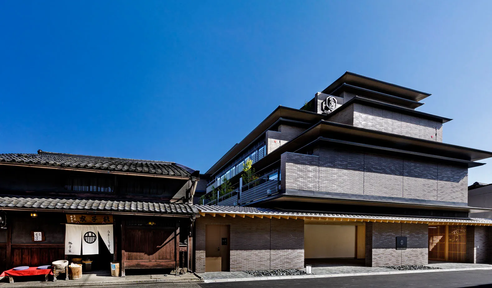 Modern industrial building exterior made of brick, concrete, and timber