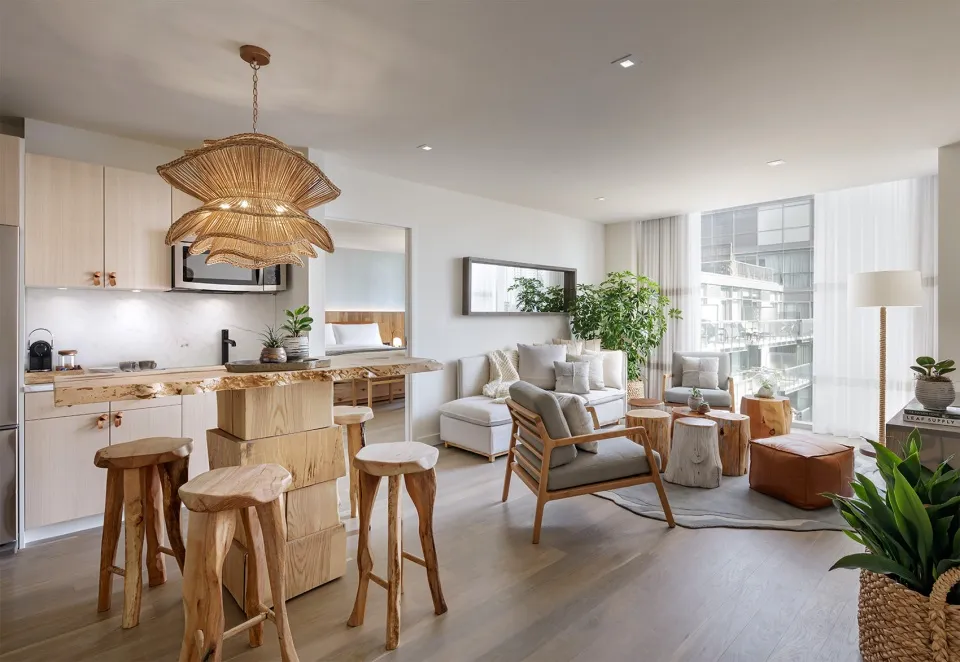 A spacious modern living room featuring wood furniture and decor.
