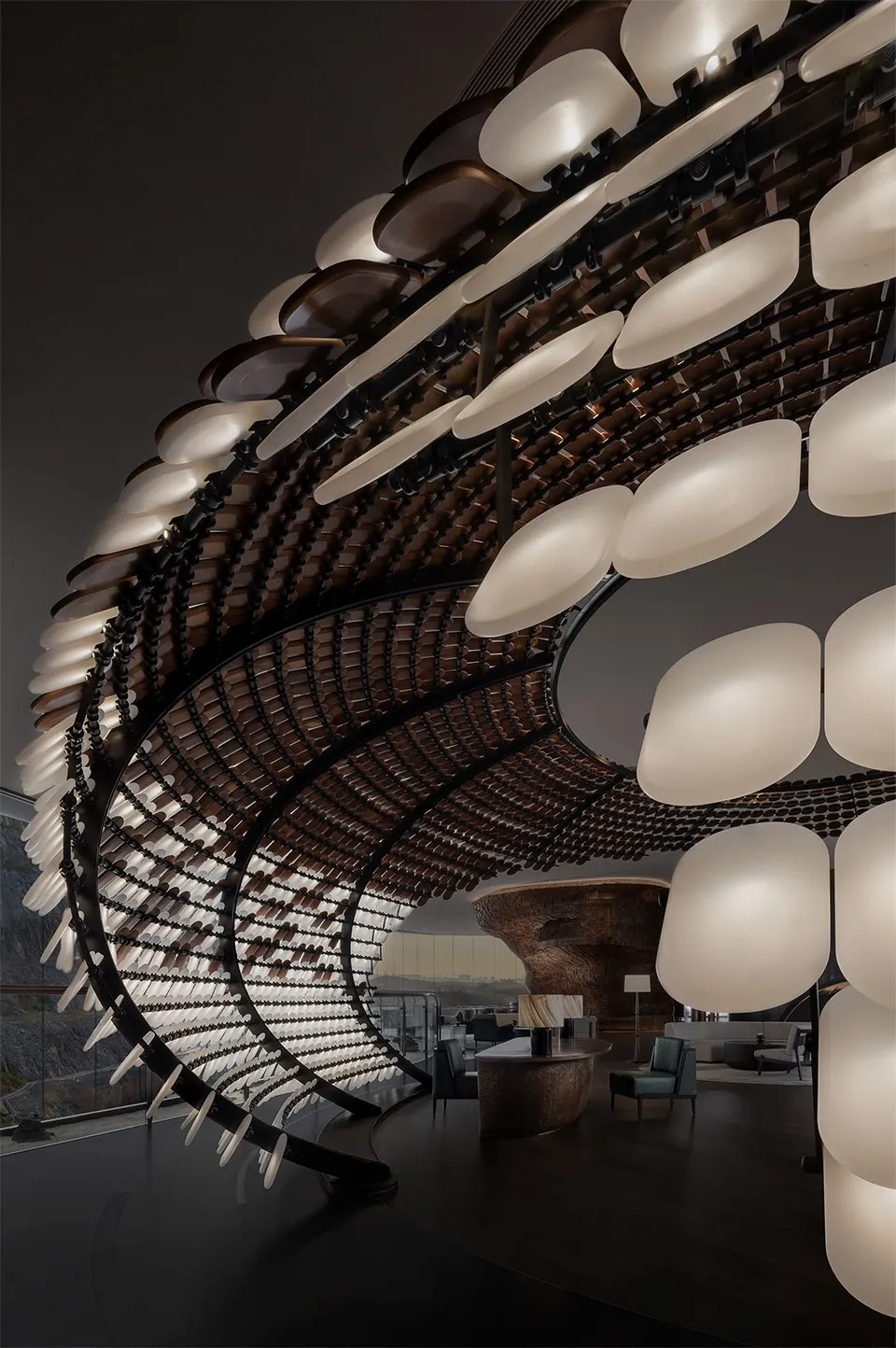 Modern lobby interior with metal and wooden elements and illuminated lighting fixtures