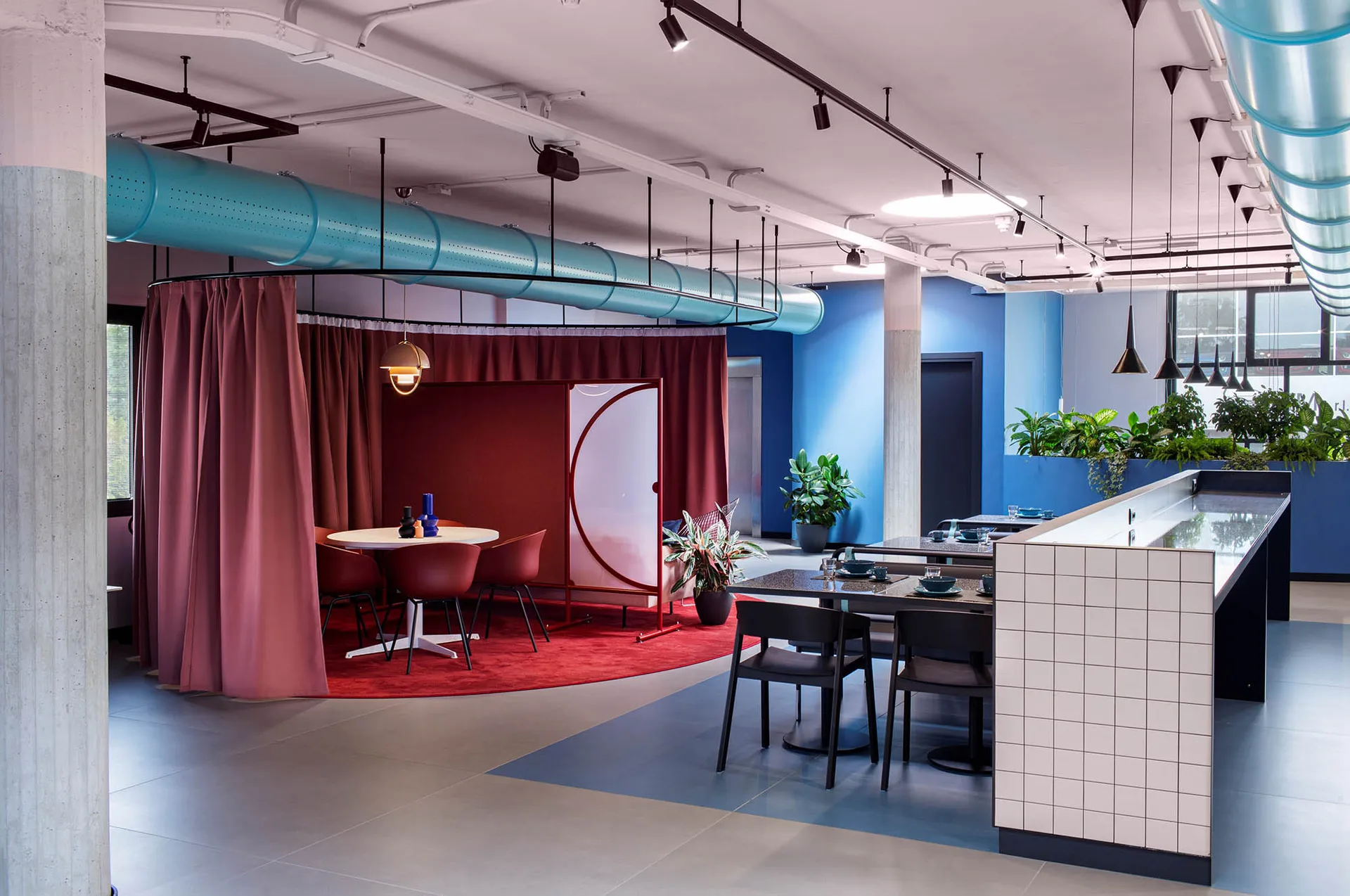 A modern cafe interior with colorful furniture and decor.