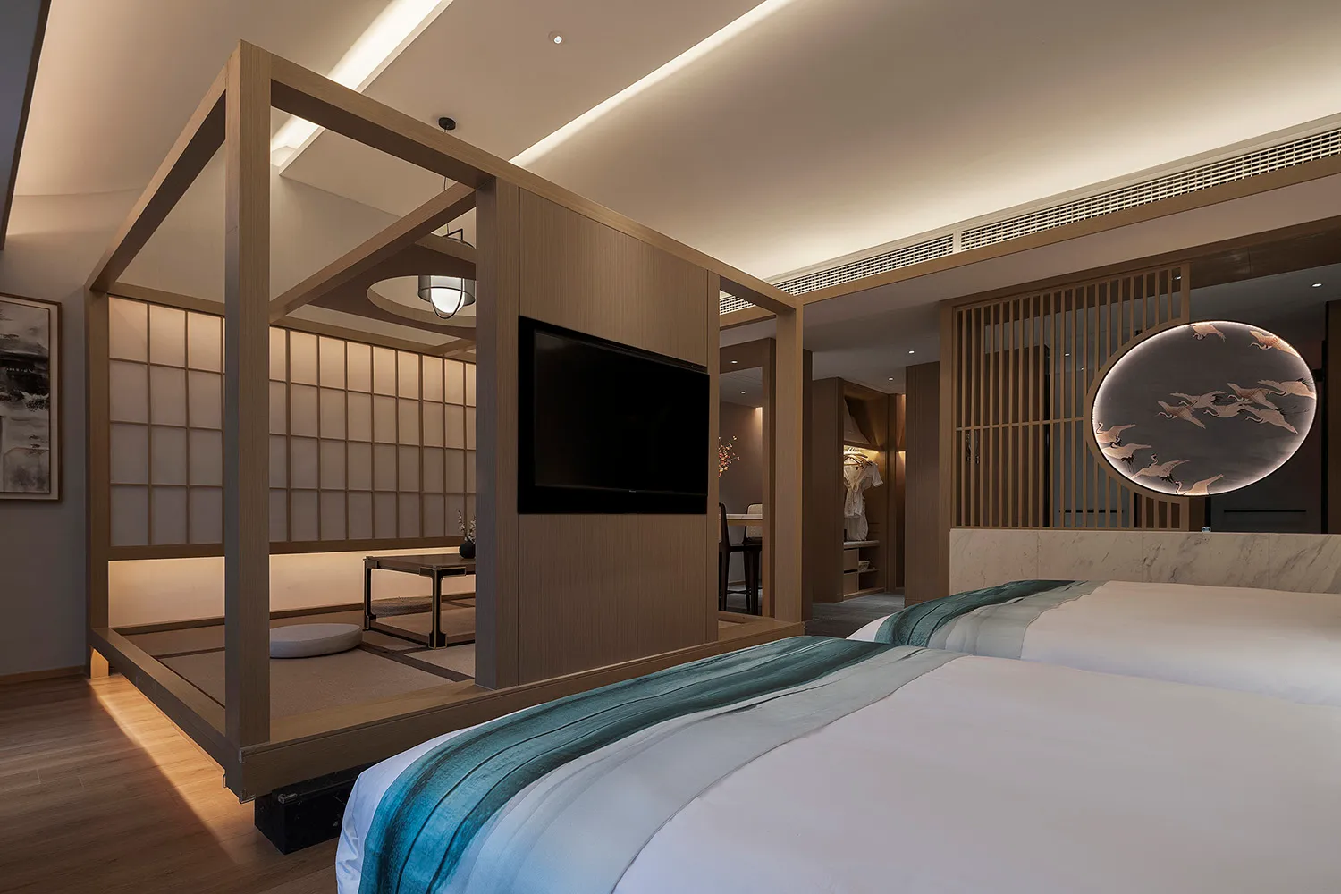 A modern bedroom featuring traditional Japanese design elements such as tatami mats, wooden frames, and a glass wall.