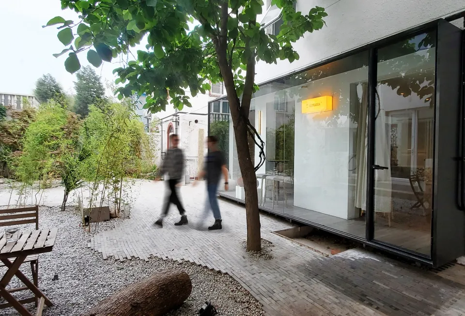 A modern interior design featuring glass walls