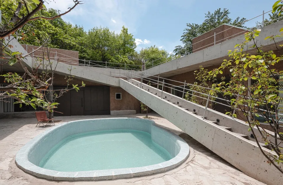 Concrete and glass modern poolside structure