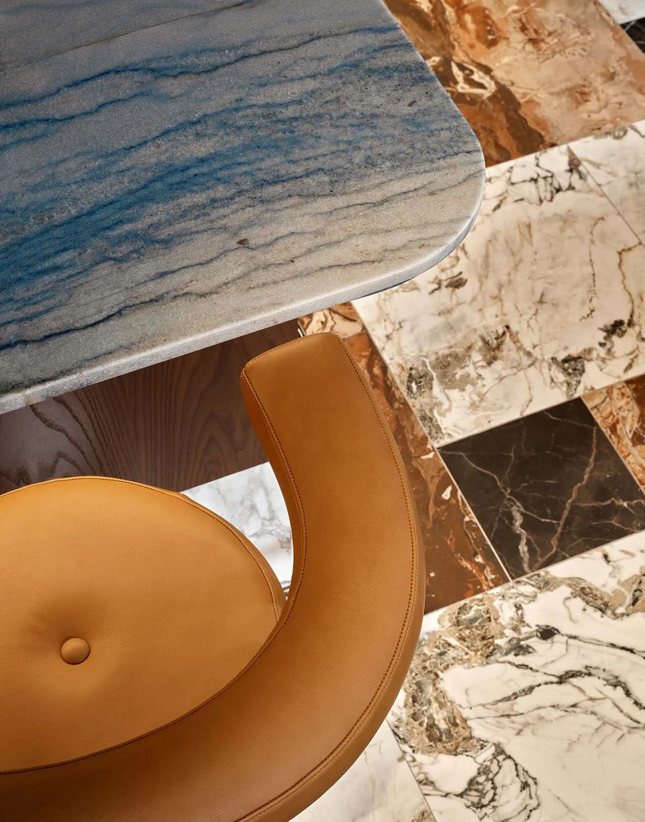 An elegant marble table with a matching marble floor.
