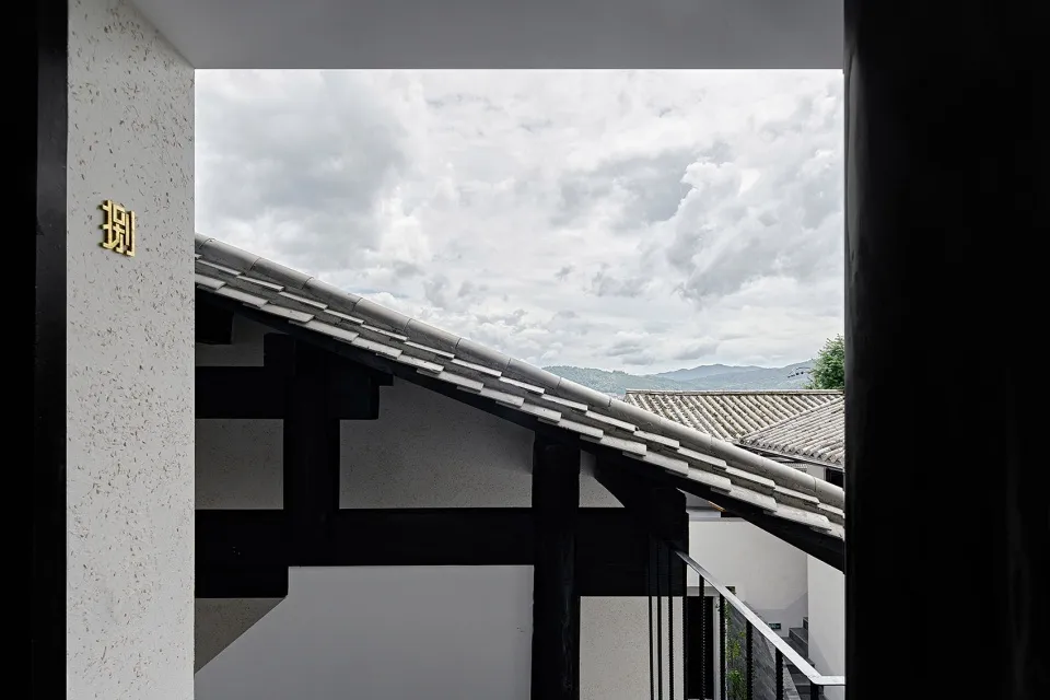 A residential building with a terrazzo roof visible through an open doorway.